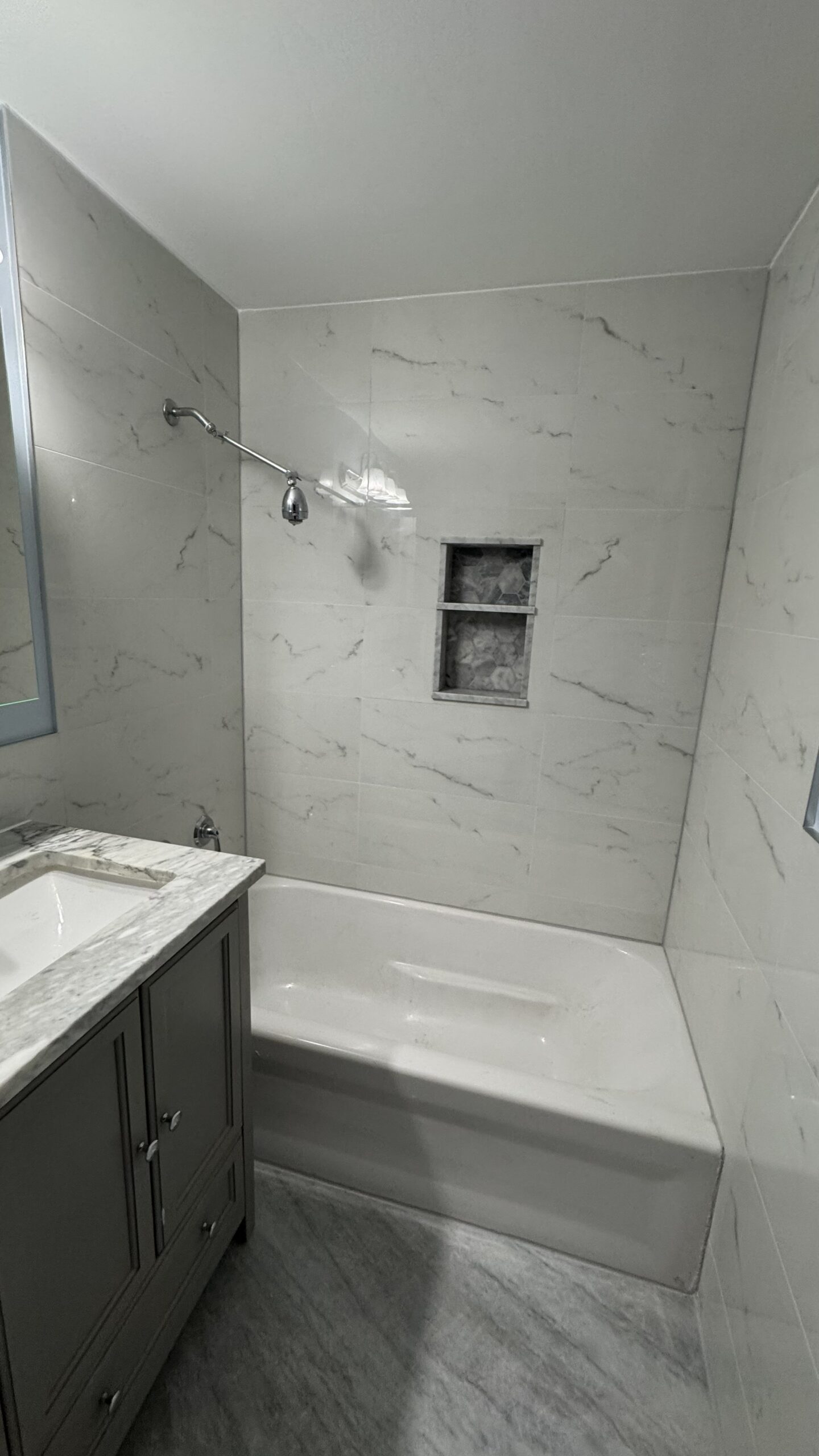 Custom Shower Niche with Mosaic Tile and Engineered Stone Shelf