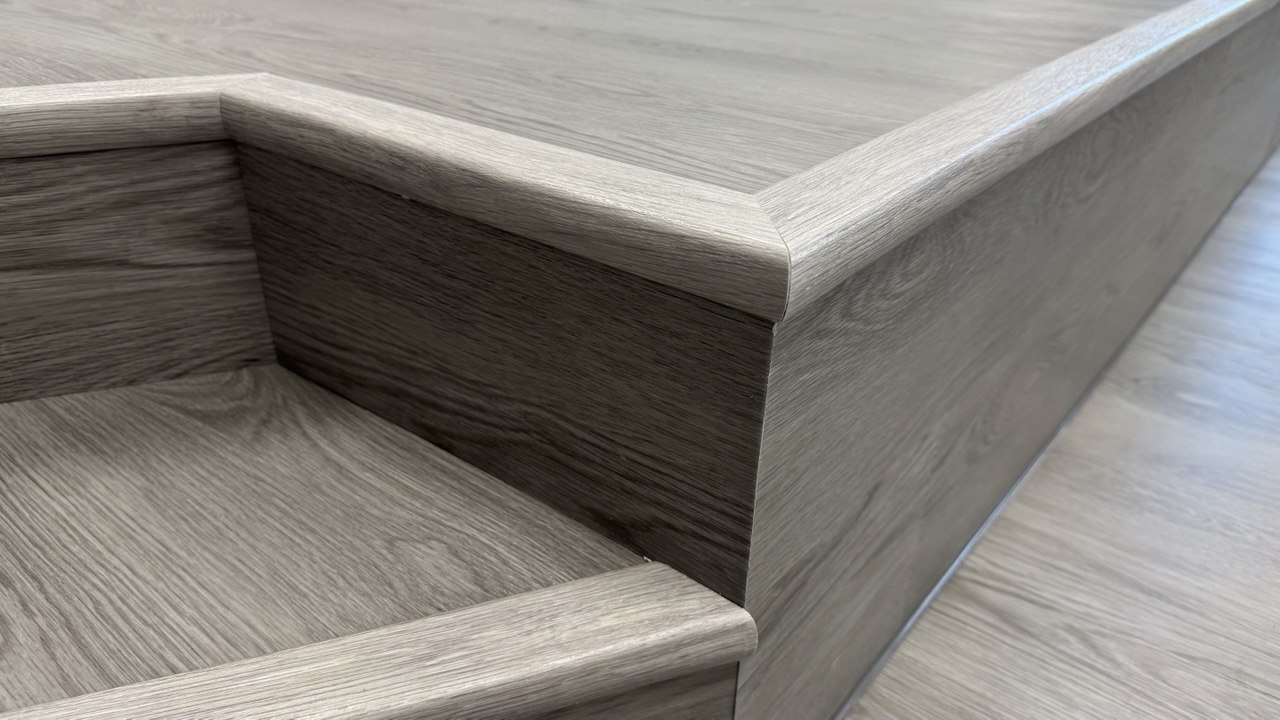 Detailed view of custom podium edge and step trim in Rockdale IL