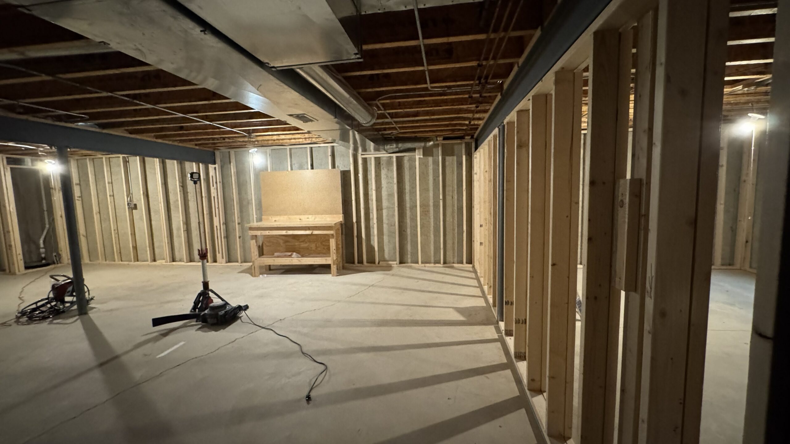 New interior framing creating functional rooms in a Plainfield, IL basement.