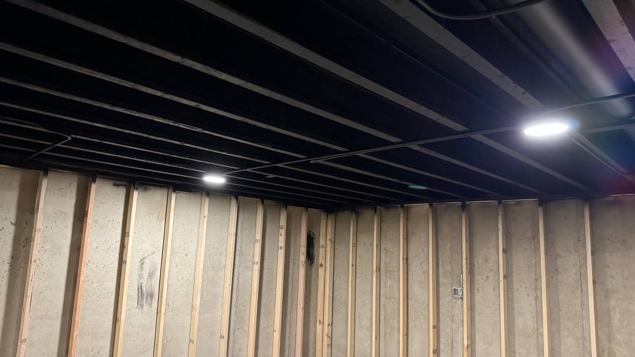 Recessed lighting installation in a finished basement.