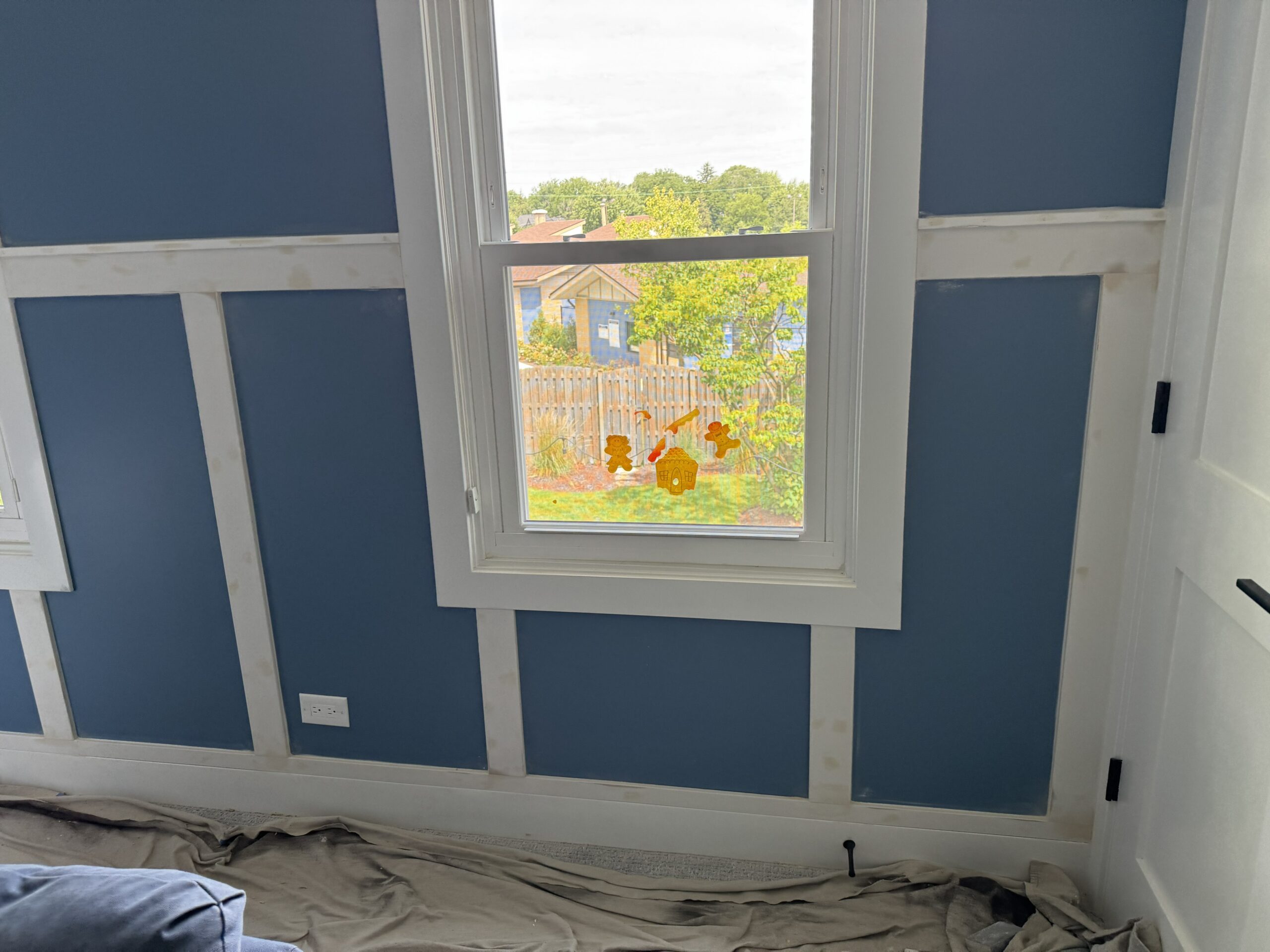 Custom board and batten trim detail around window in Clarendon Hills IL