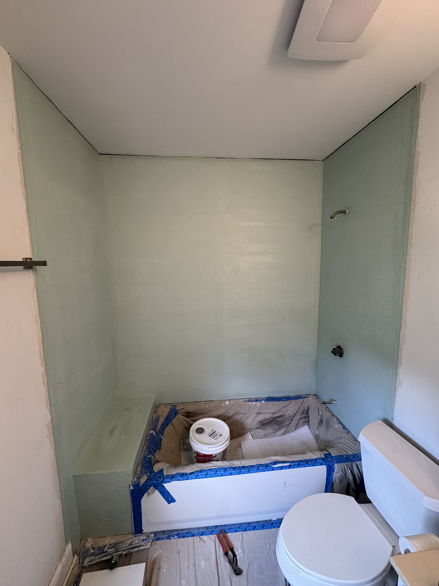 MAPEI liquid waterproofing membrane applied around bathtub in Aurora IL