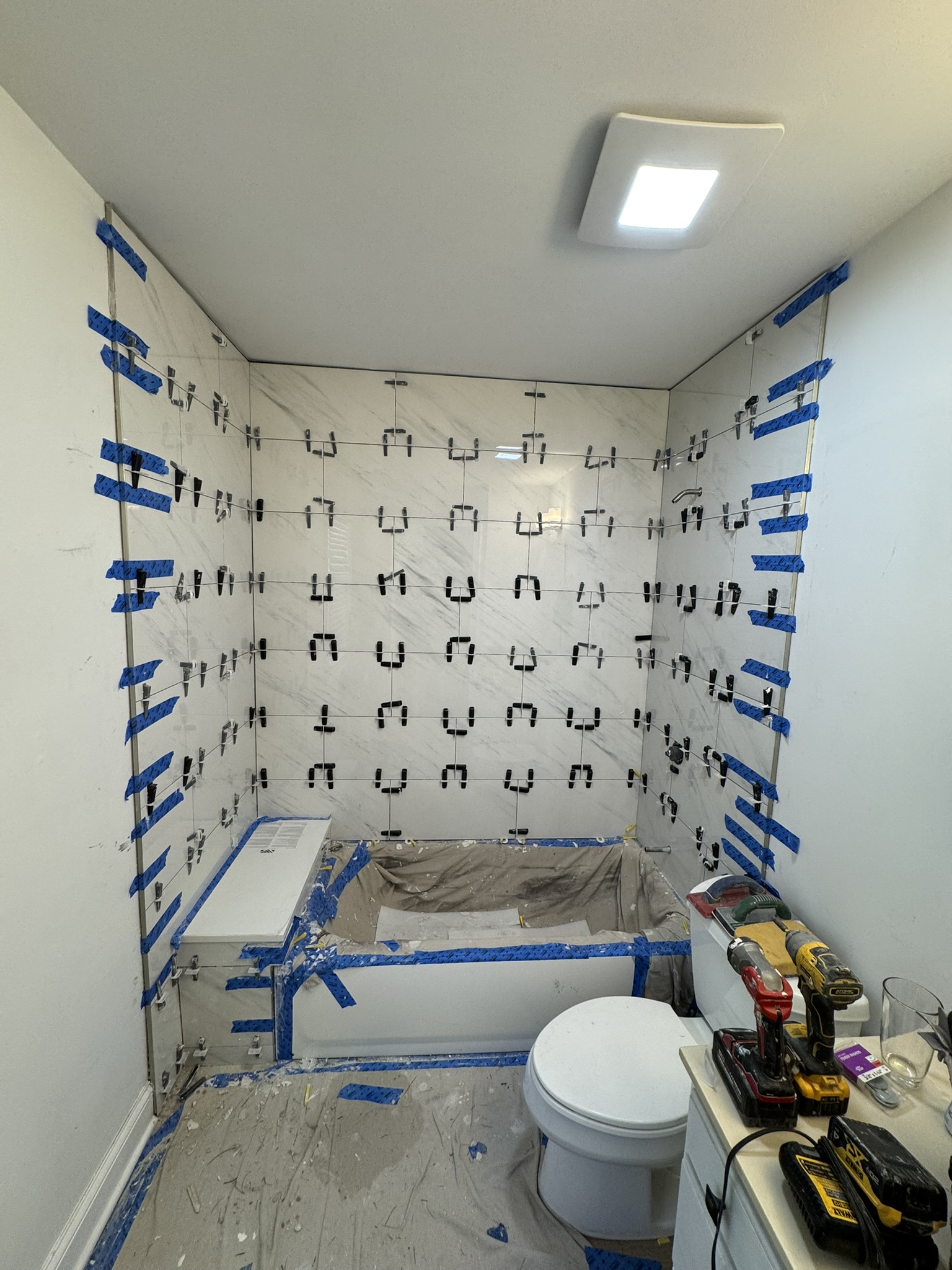 Tile installation around bathtub and custom platform in Aurora IL