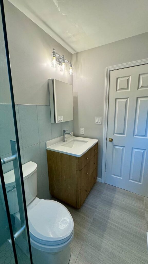 Completed bathroom renovation with new vanity and tile in Geneva IL