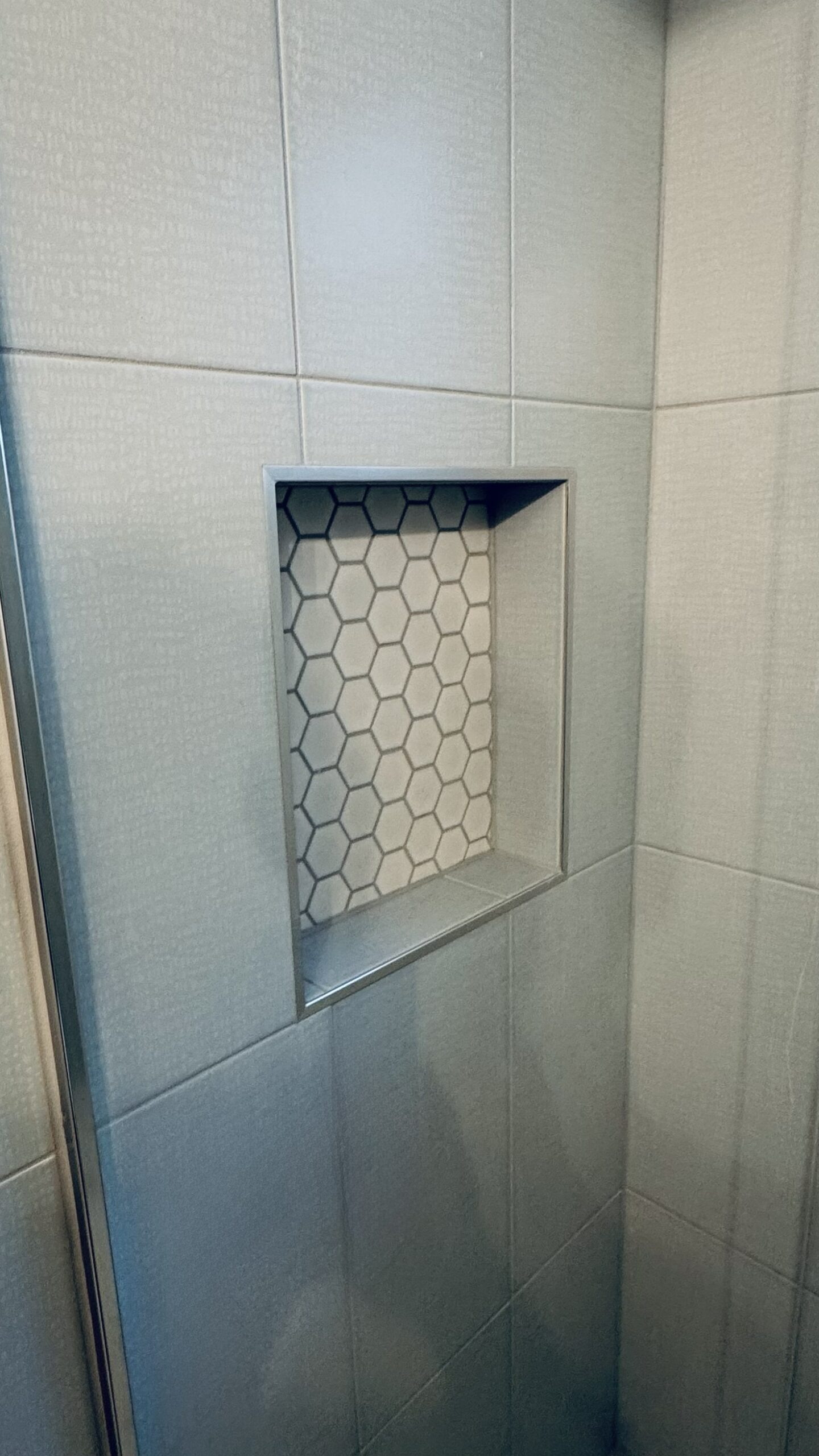 Custom Shower Niche with Mosaic Tile and Engineered Stone Shelf